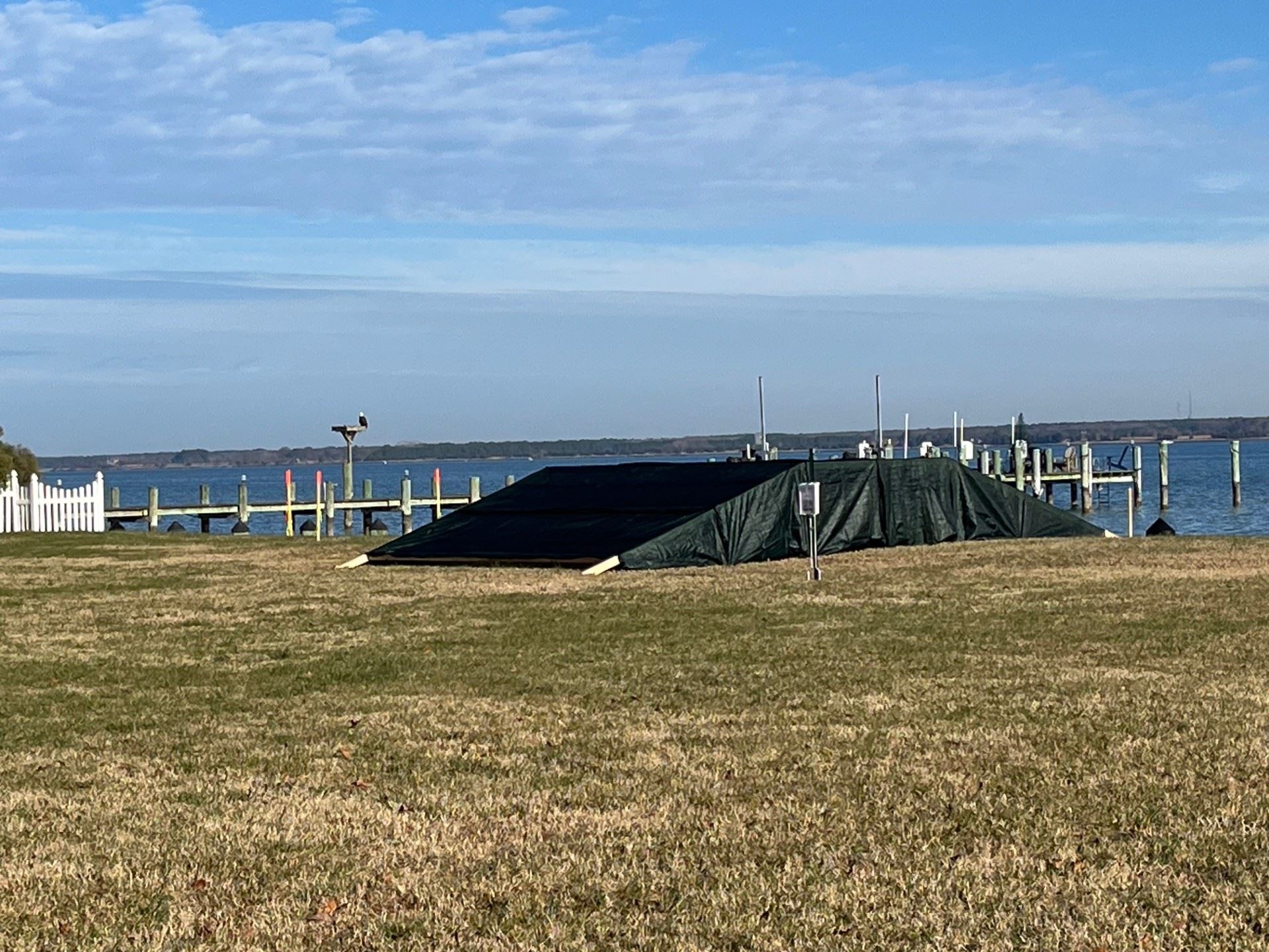 Berm Example - An example created with two by fours and plywood with a green tarp covering